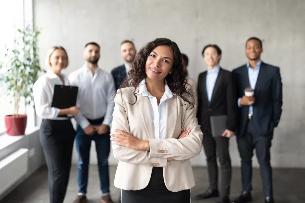 businesswoman standing in front of her employees p 2023 11 27 05 19 06 utc