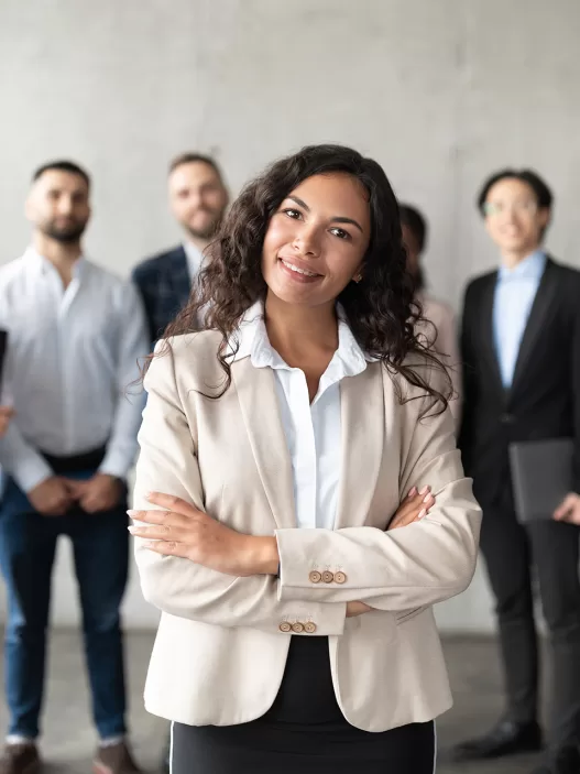 businesswoman standing in front of her employees p 2023 11 27 05 19 06 utc