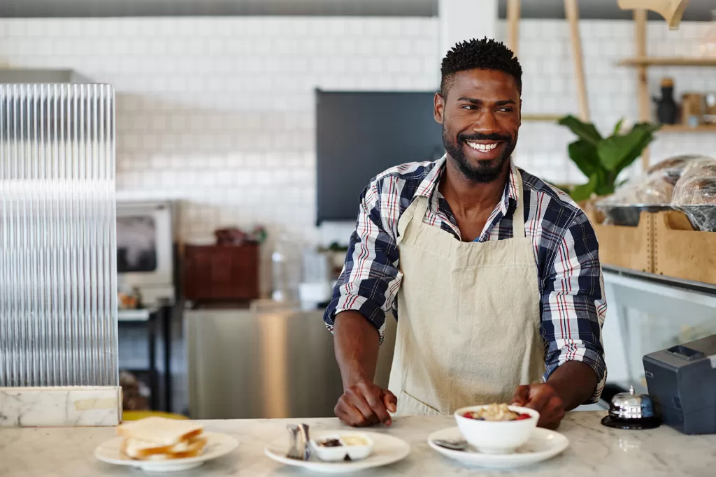 cropped shot of a handsome young man working in a 2025