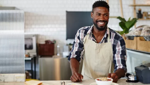 cropped shot of a handsome young man working in a 2025