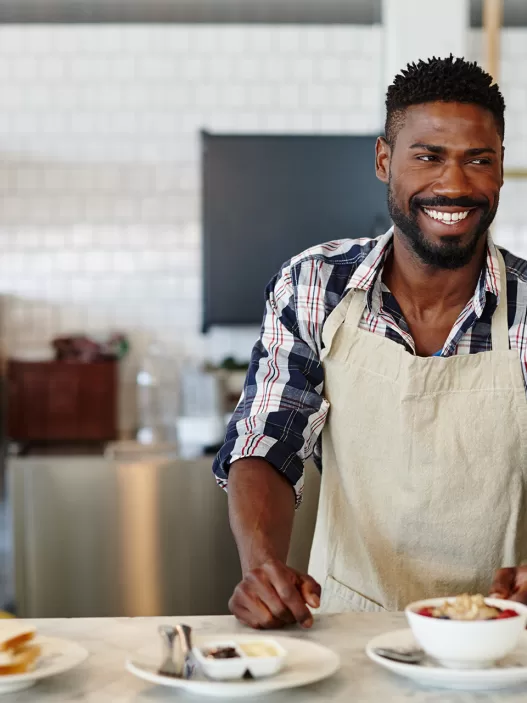 cropped shot of a handsome young man working in a 2025