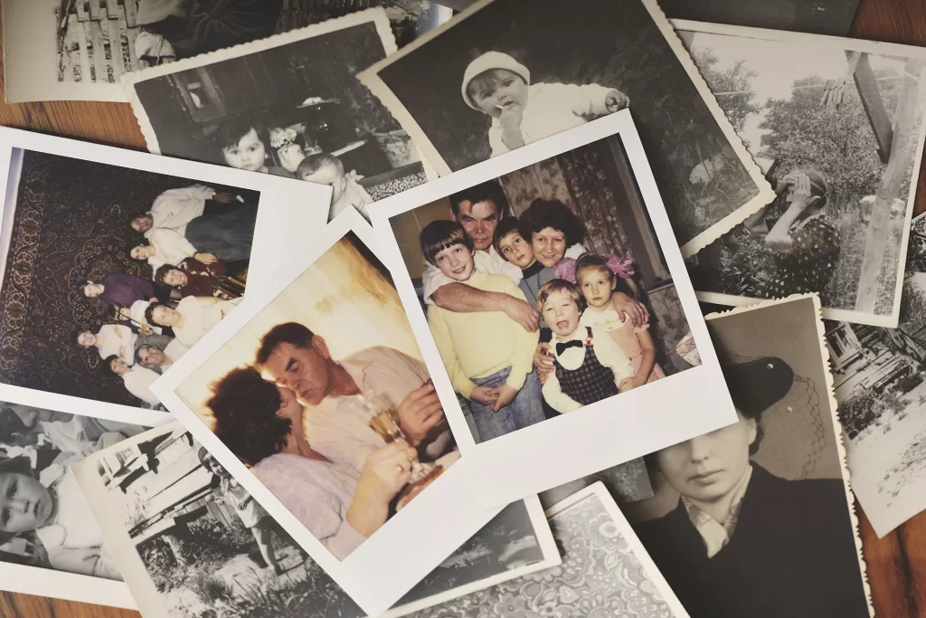 pile of family photographs on table overhead view 2024 06 13 16 58 12 utc