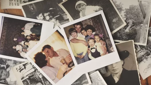 pile of family photographs on table overhead view 2024 06 13 16 58 12 utc