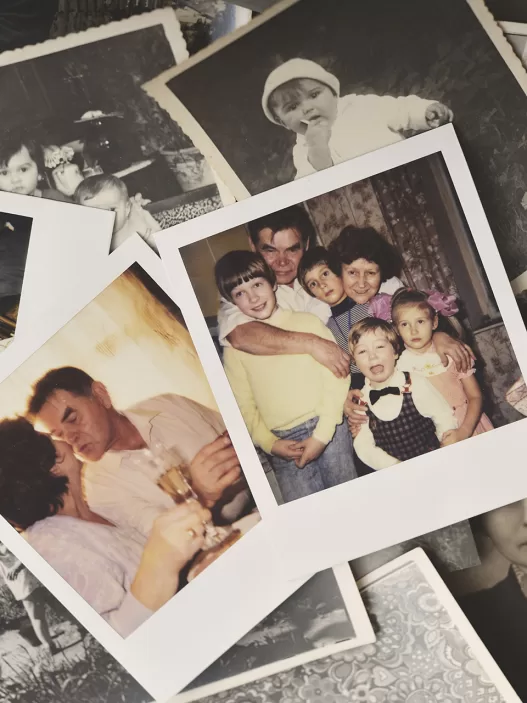 pile of family photographs on table overhead view 2024 06 13 16 58 12 utc