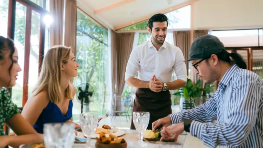 waitress man serving food to group of diverse cust 2024 09 04 00 40 35 utc