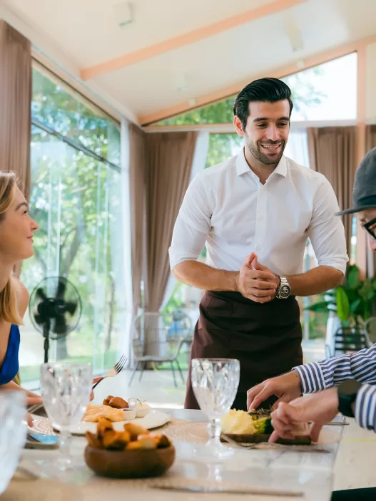 waitress man serving food to group of diverse cust 2024 09 04 00 40 35 utc