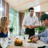 waitress man serving food to group of diverse cust 2024 09 04 00 40 35 utc